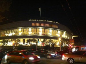 Davies Symphony Hall at night from the street level. The building was designed specifically to look open and inviting from the outside