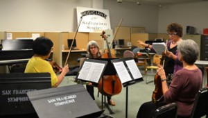 A local amateur string trio being coached by SFS cellist Barbara Bogatin during the Community of Music Makers event. 